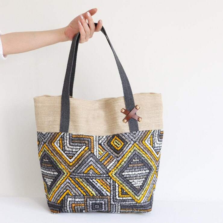 imgi_30_woman-holding-craft-bag-with-white-background_978182-52